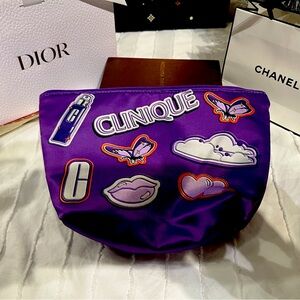 Clinique EUC purple cosmetic pouch. 10 in by 6 in